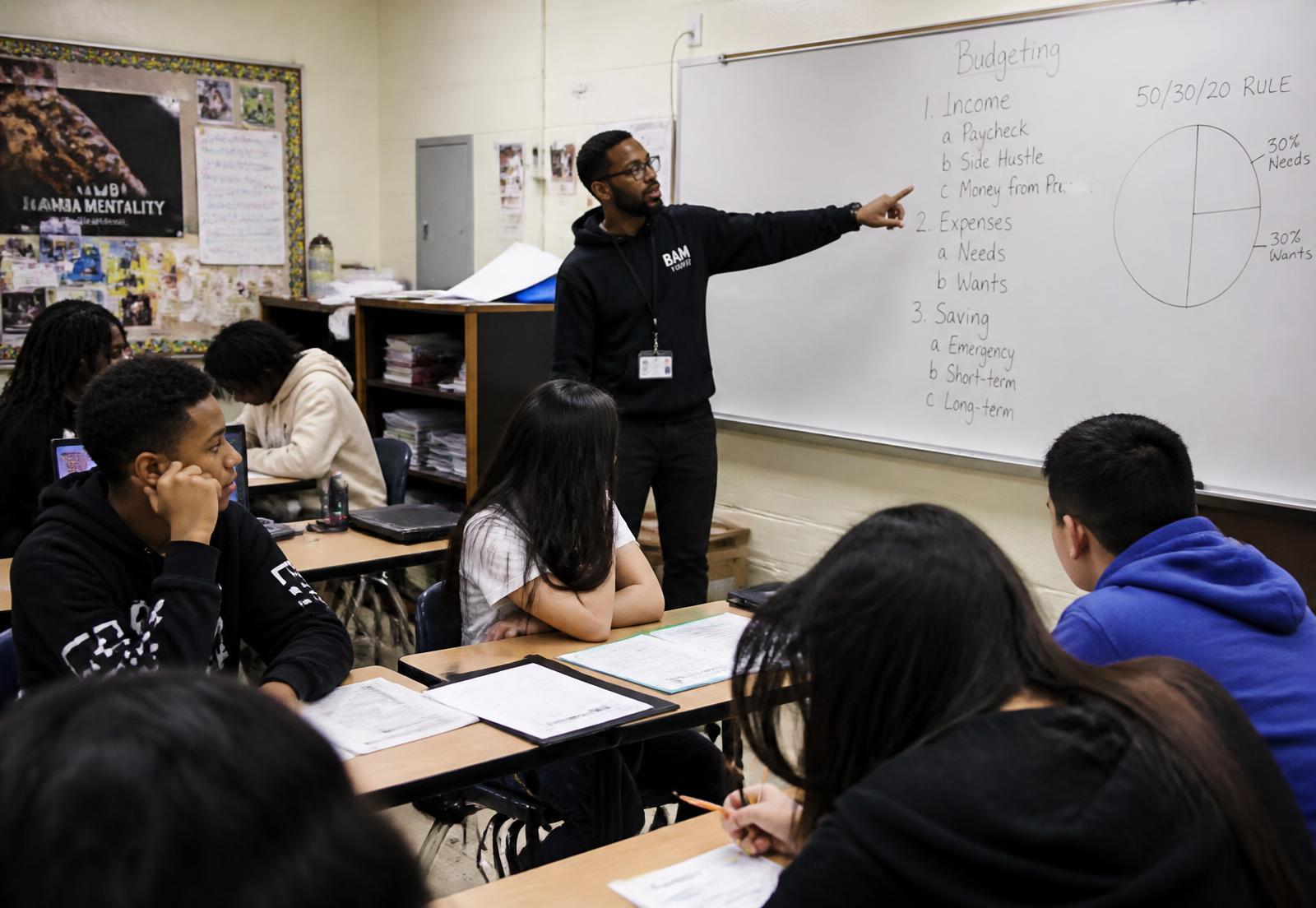 High school students in a Y.E.W.P. classroom workshop learning budgeting